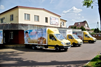 Woman stocking shelves with bread