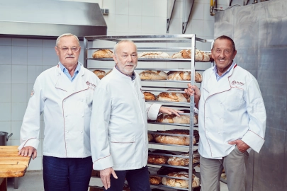 Woman stocking shelves with bread
